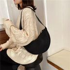Shoulder bag with practical compartment system and adjustable shoulder strap