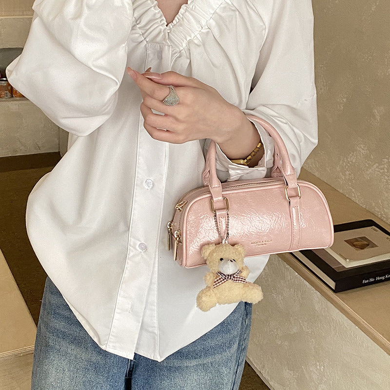 Women's mini handbag with playful teddy pendant