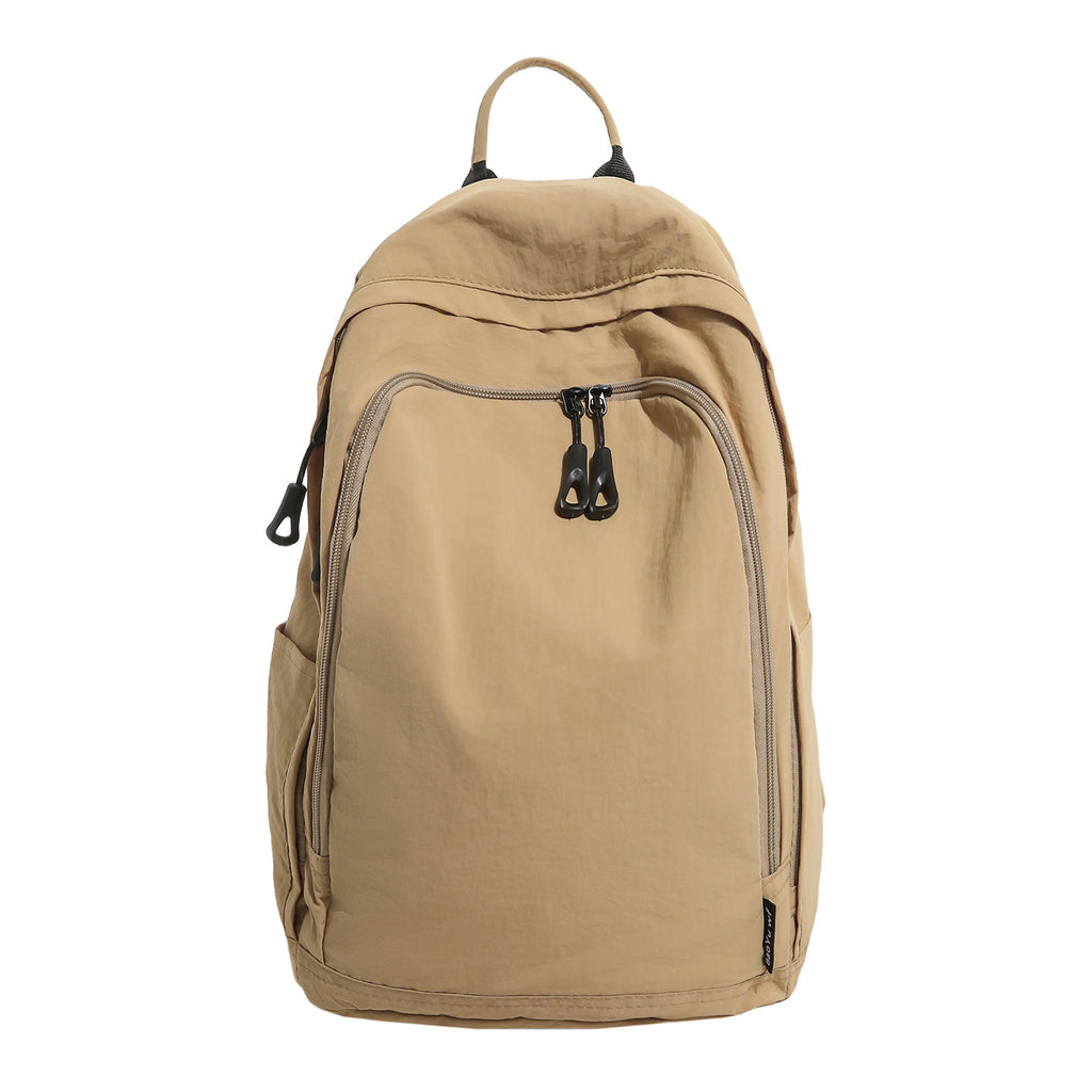 City backpack with versatile compartments and breathable carrying system