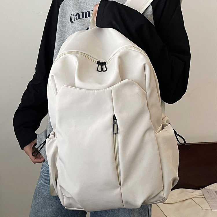 Backpack with Versatile Compartments and Charming Pendant