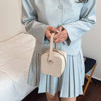Ladies mini handbag with removable shoulder strap and elegant flap closure