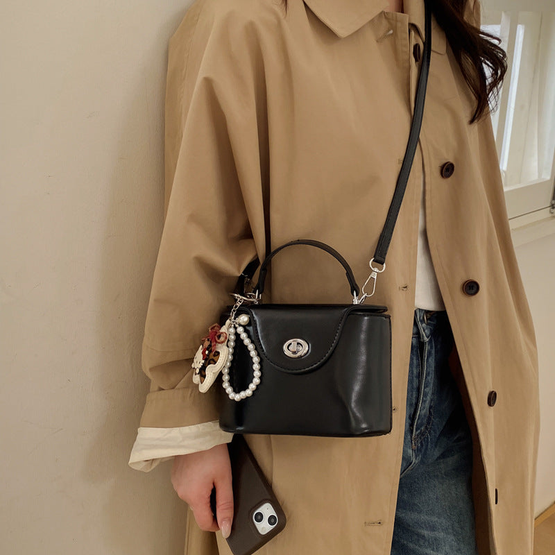 Ladies elegant mini handbag with stylish charm