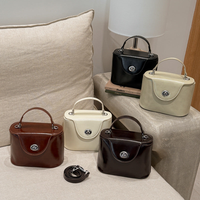 Ladies elegant mini handbag with stylish charm