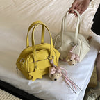 Ladies mini bag with decorative pendant