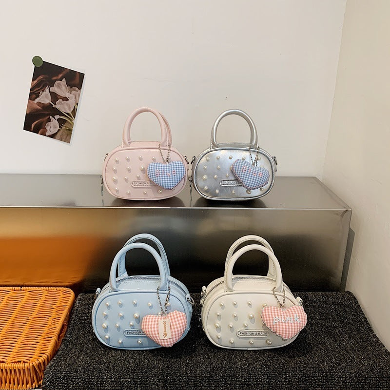 Ladies trendy mini handbag with striking pearl applications