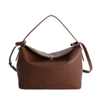 Women's handbag with flexible strap and elegant design