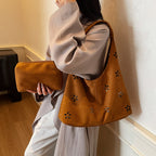 Women's hobo bag with floral accent and practical mini wallet