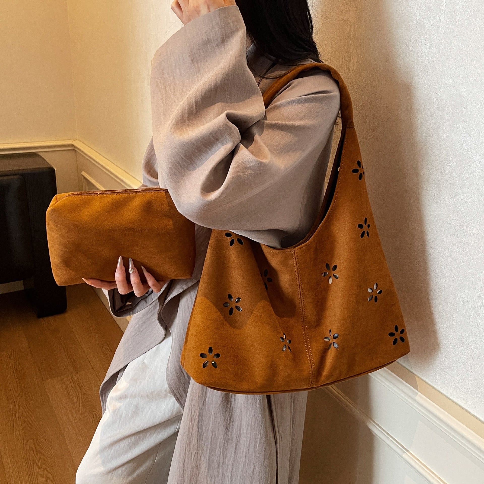 Women's hobo bag with floral accent and practical mini wallet