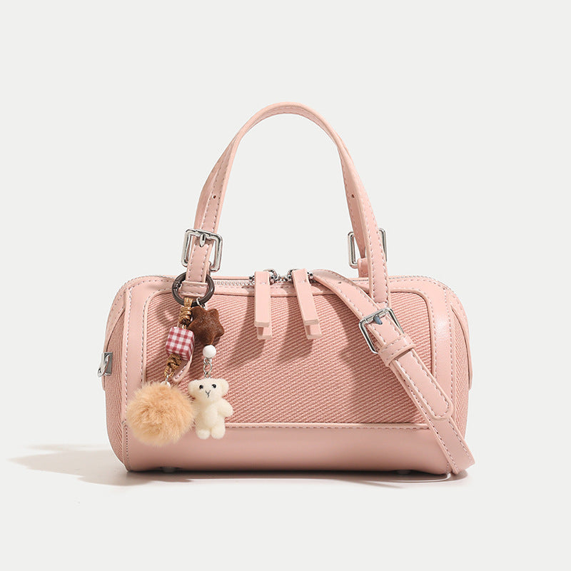 Women's mini bag with playful charm