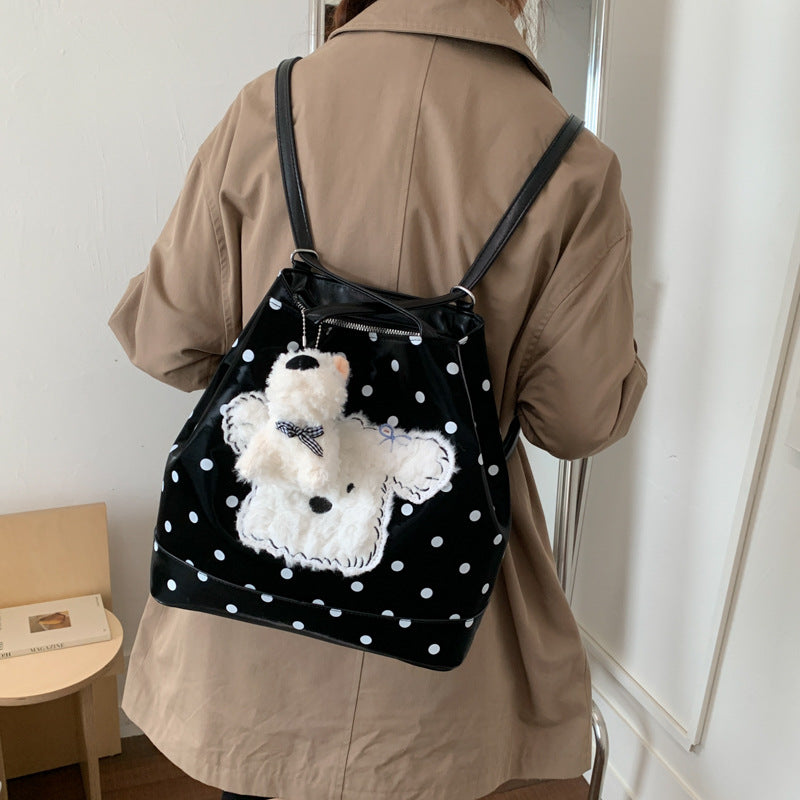 Plush shoulder bag with playful dog motif