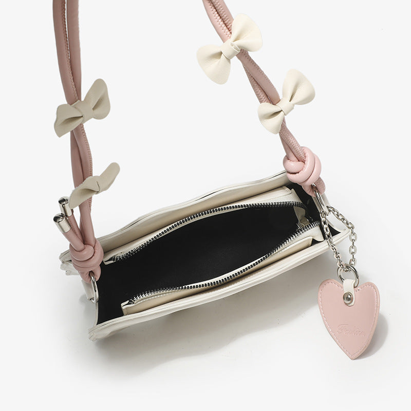 Women's mini handbag with creative wave pattern and playful pendant