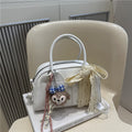 Ladies Mini Handbag with playful animal motif and charming charm