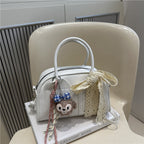 Ladies Mini Handbag with playful animal motif and charming charm
