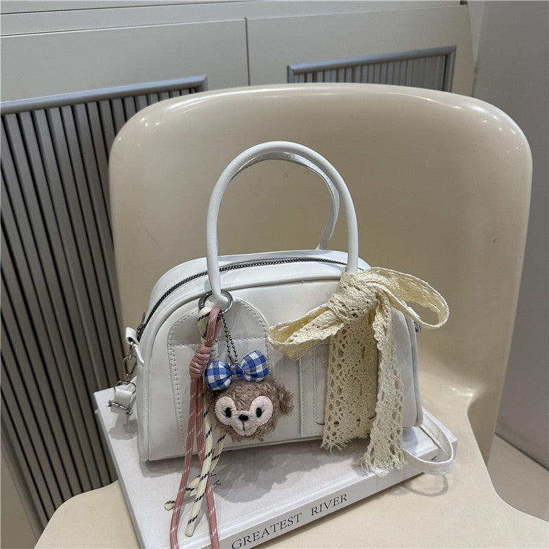 Ladies Mini Handbag with playful animal motif and charming charm