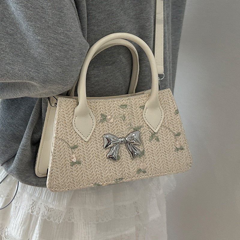Ladies mini bag with floral woven design and stylish bow detail