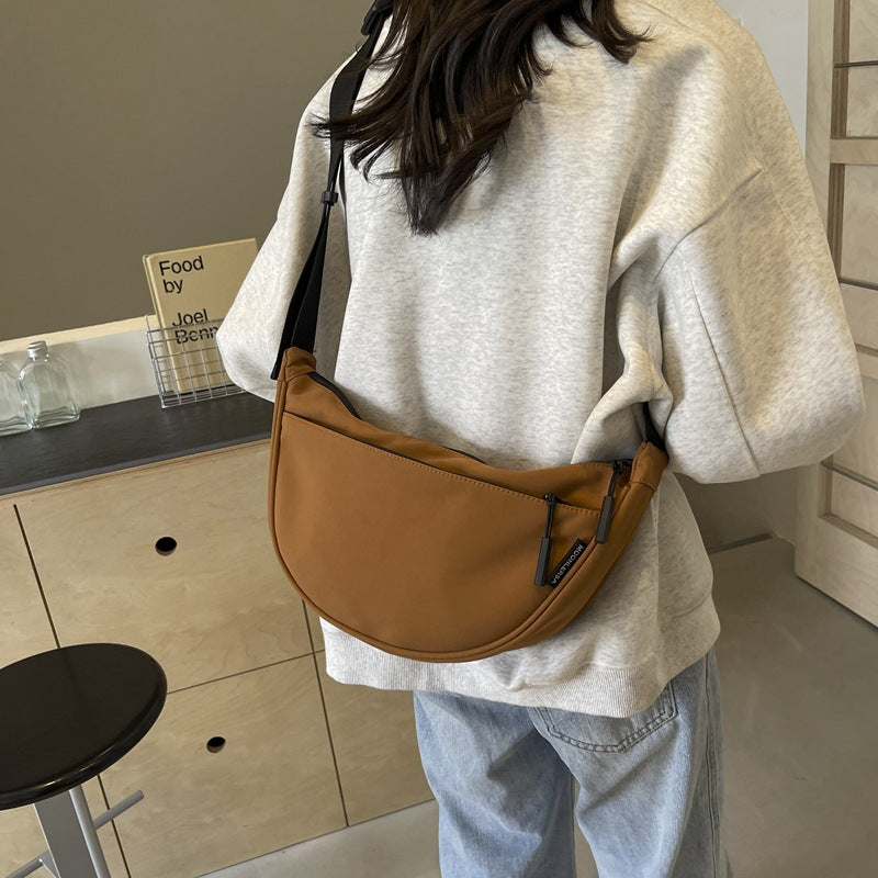 Shoulder bag with adjustable strap and multiple compartments