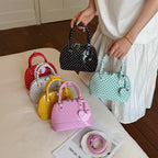 Women’s mini handbag with playful polka dot pattern and detachable shoulder strap
