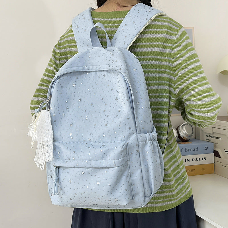 Elegant backpack with glittering stars and practical compartments
