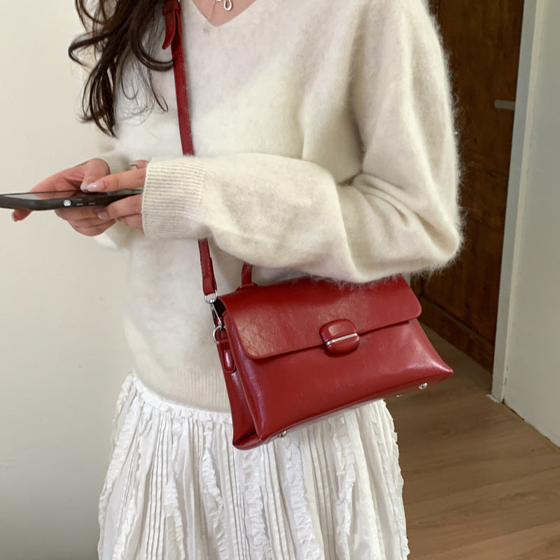 Women's handbag with textured design and elegant closure