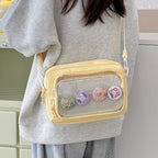 Shoulder bag with transparent viewing pocket and playful graphic design