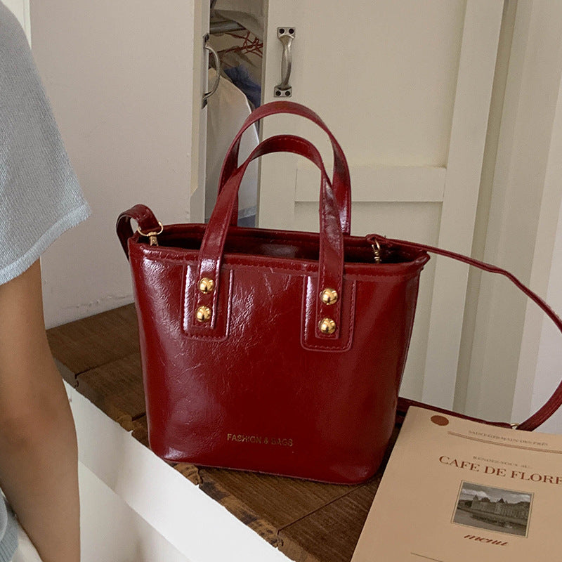Women's mini bag with elegant structure and practical carrying handle