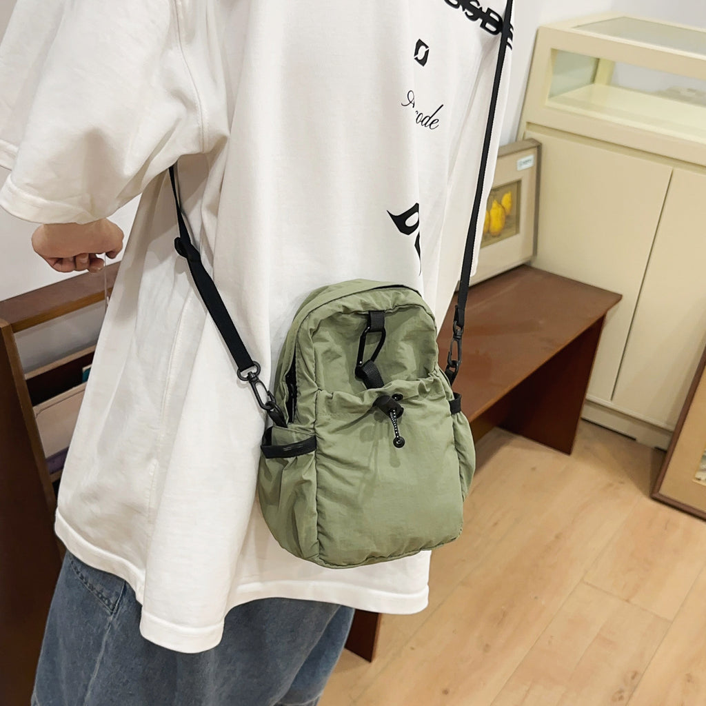 Practical crossbody backpack with multifunctional compartments