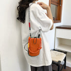 Women's multifunctional mini crossbody bag made of durable material with adjustable shoulder strap