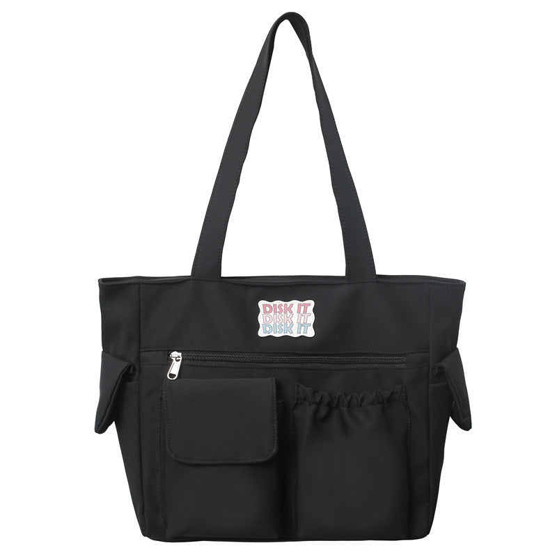Tote bag with versatile compartments and ergonomic design
