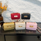 Women’s mini handbag with quilted design and golden clasp