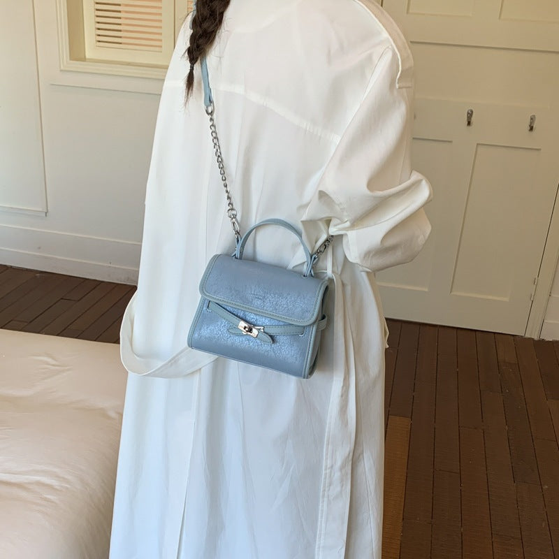 Ladies fashionable mini handbag with decorative magnetic closure