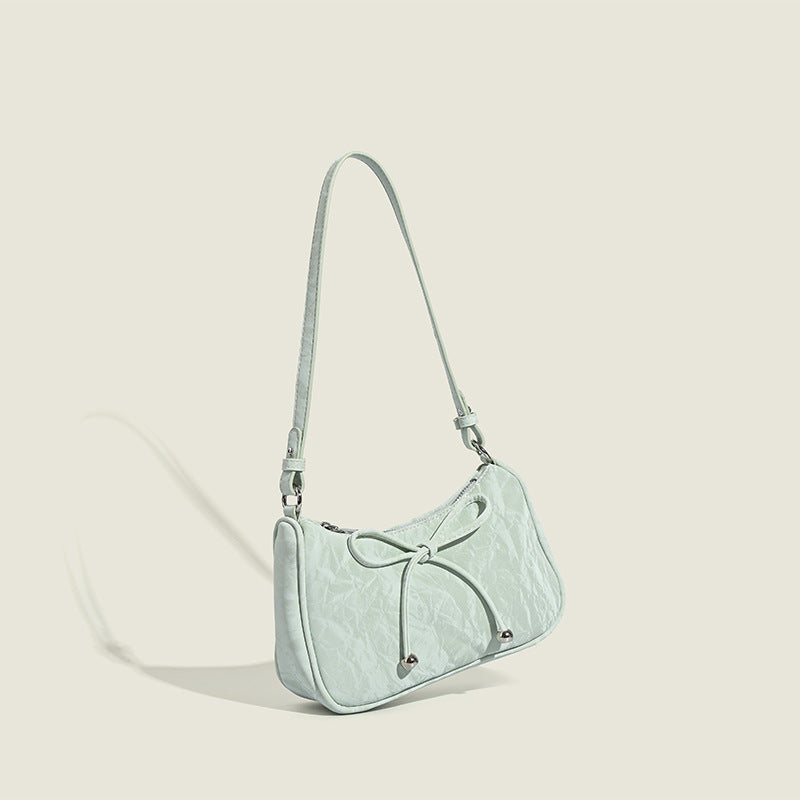 Ladies elegant mini handbag with playful drawstring
