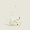 Ladies elegant mini handbag with playful drawstring
