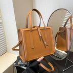 Women's elegant handbag in minimalist design with detachable shoulder strap