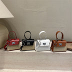 Ladies mini handbag with luxurious leather look and practical carrying handles