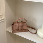 Women's elegant mini handbag with textured design