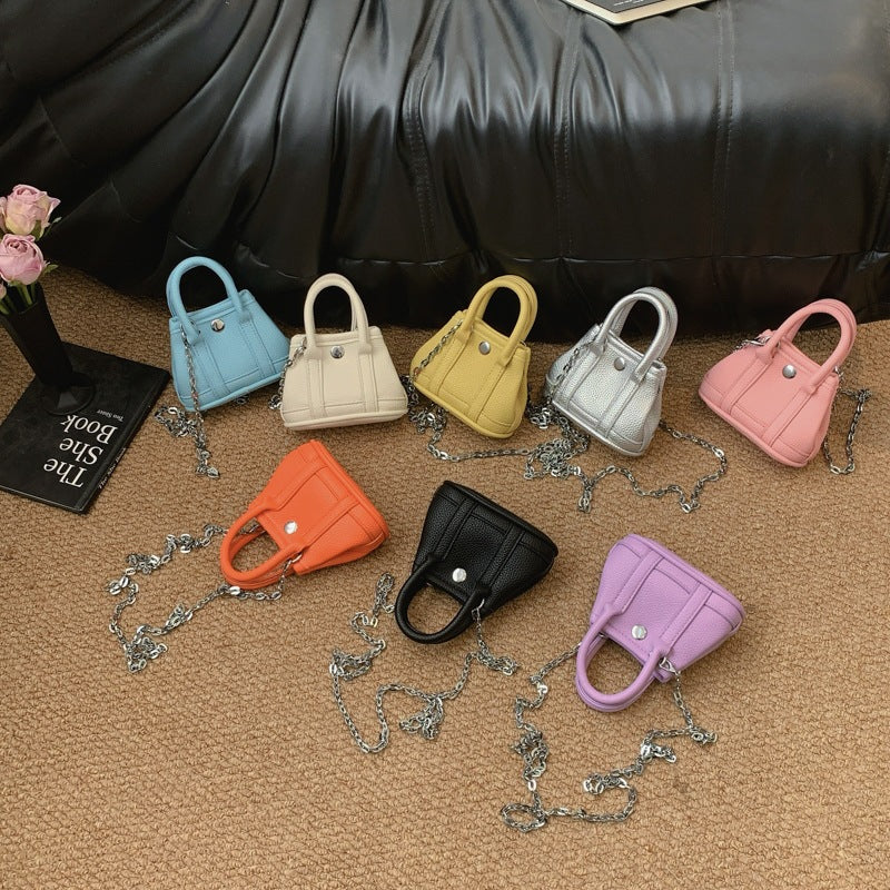 Ladies mini handbag with smooth structure and removable chain strap