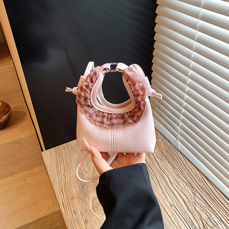 Women’s mini handbag with trendy ruffle design