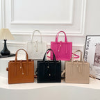 Women's elegant handbag in minimalist design with detachable shoulder strap