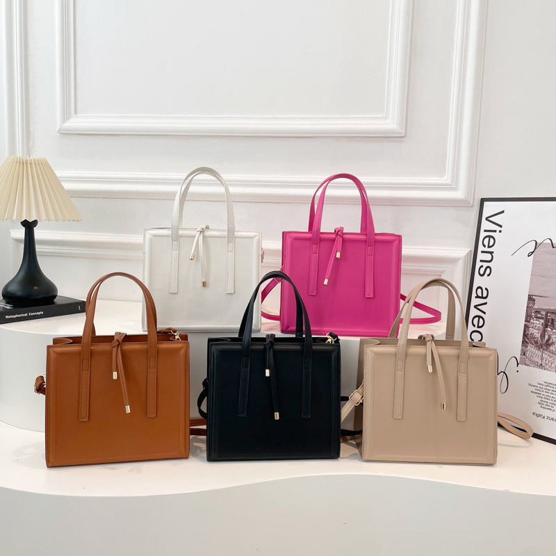 Women's elegant handbag in minimalist design with detachable shoulder strap