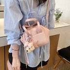 Ladies mini bag with decorative pendant