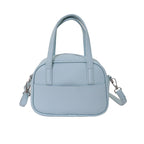 Women's mini handbag with playful animal charm