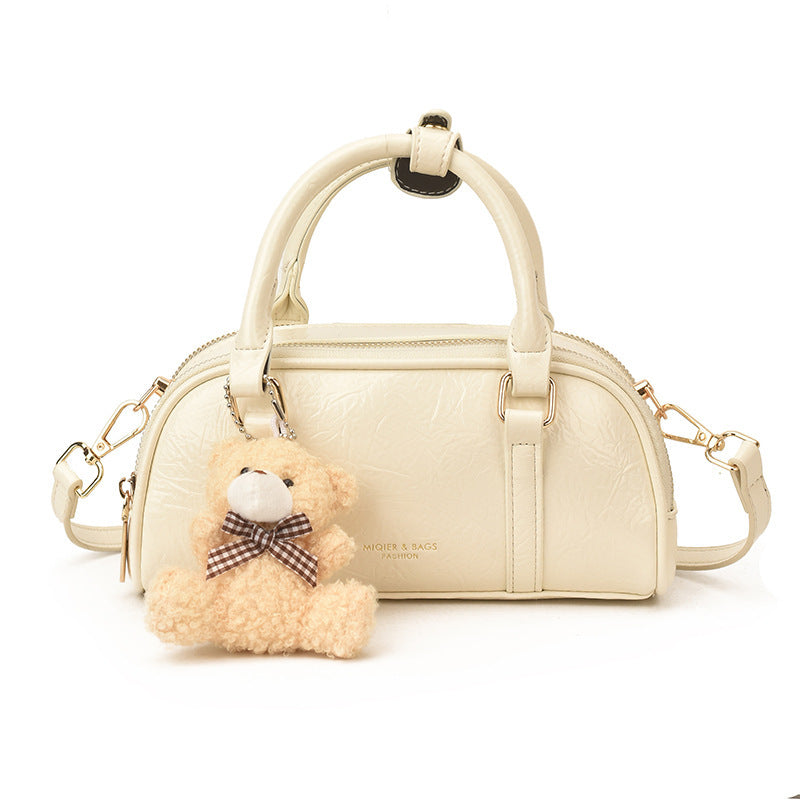 Women's mini handbag with playful teddy pendant