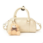 Women's mini handbag with playful teddy pendant