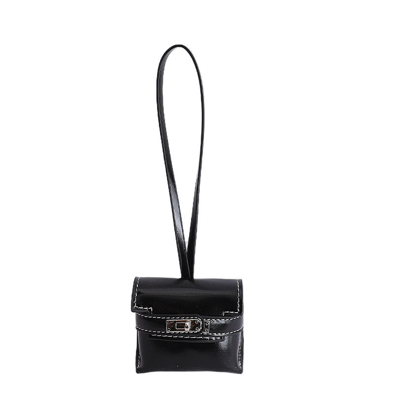 Ladies mini handbag made of high-quality artificial leather with playful closure