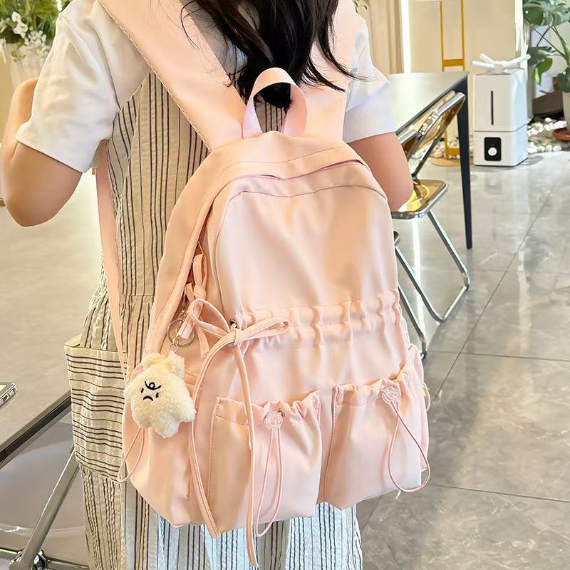 City backpack with innovative compartment system and adjustable carrying straps