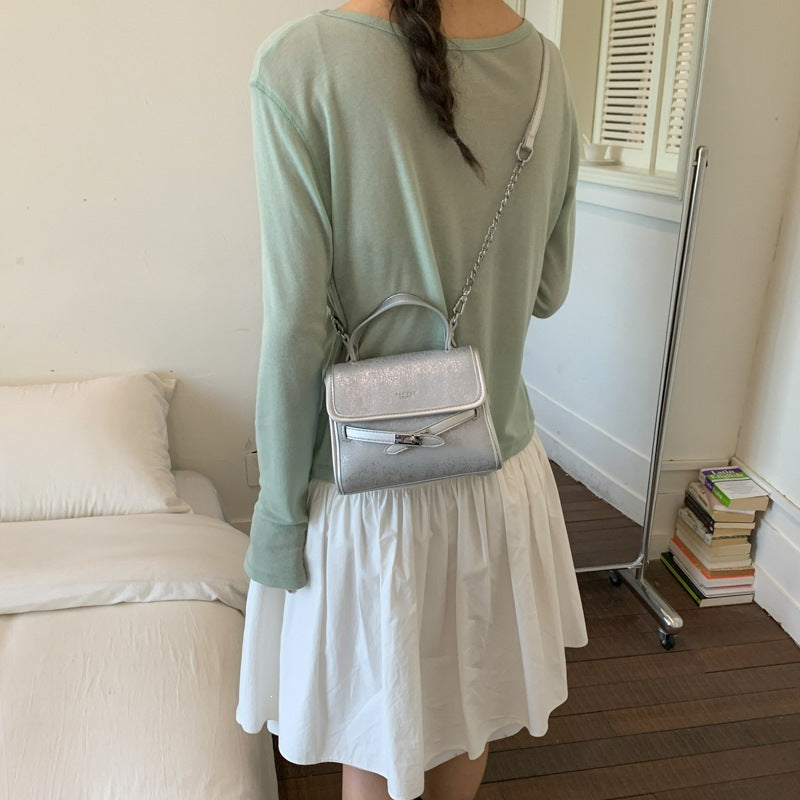Ladies fashionable mini handbag with decorative magnetic closure