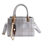Women's mini handbag with elegant structure and golden accents