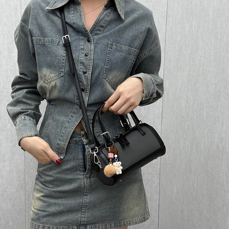 Women's mini bag with playful charm