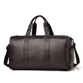 Travel bag made of high-quality leather with robust carrying handles