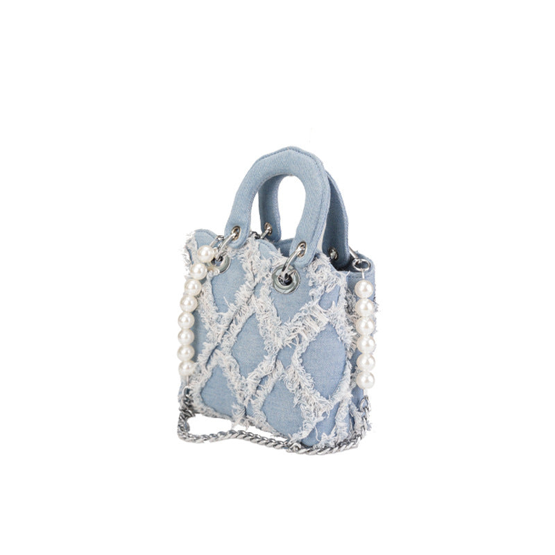 Women’s mini handbag with striking cinched design and pearl accents
